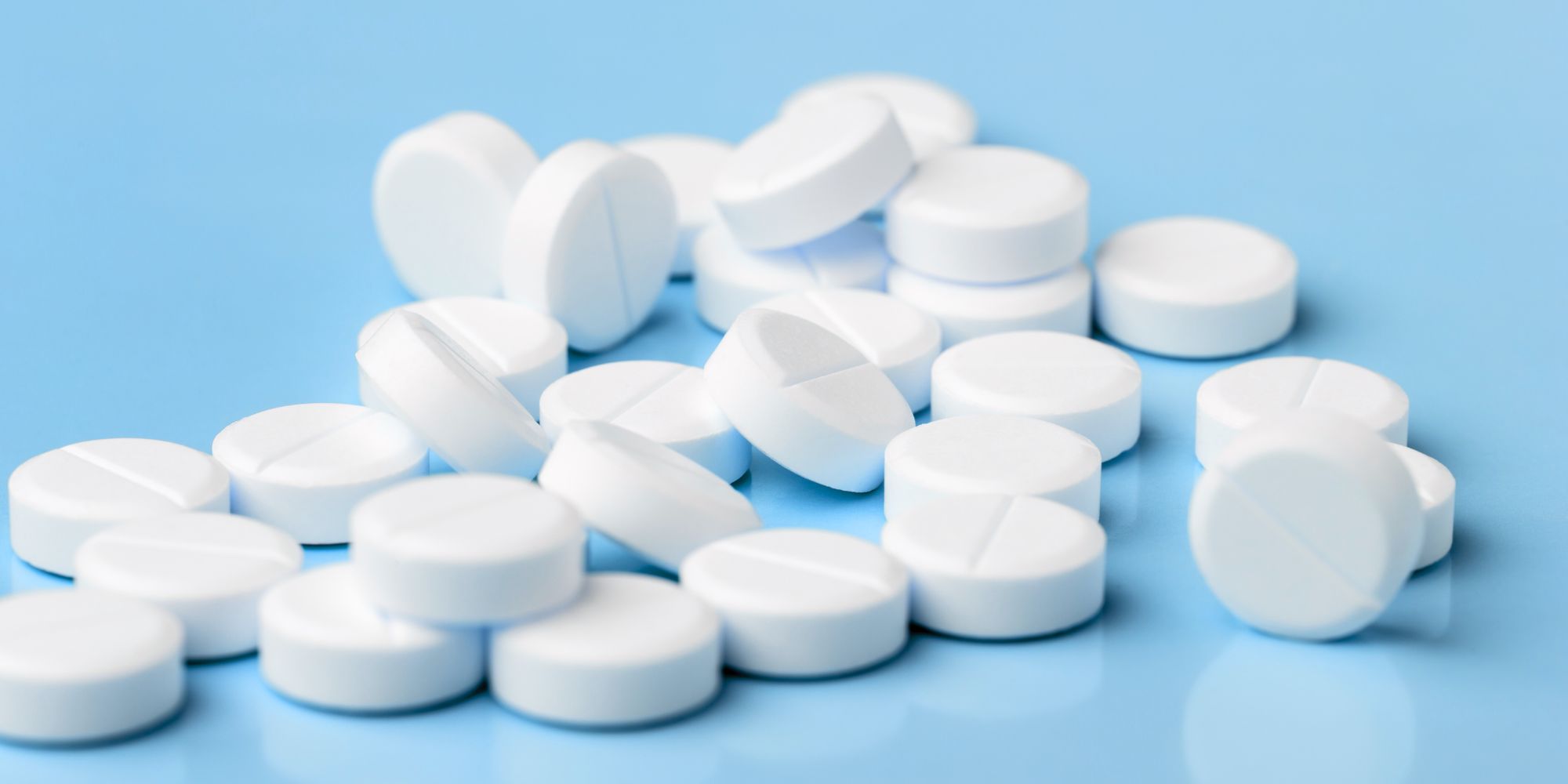 blue background with cytotec pills